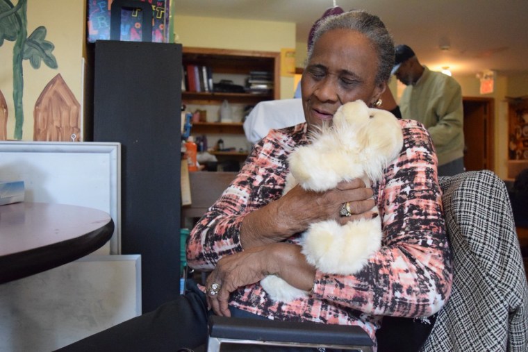 A woman holding a Therapalz prototype.