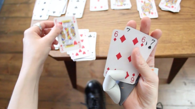 Using the third thumb while playing cards