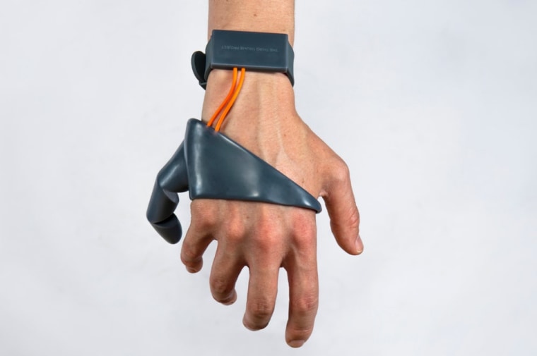 A closeup of the third thumb prosthetic