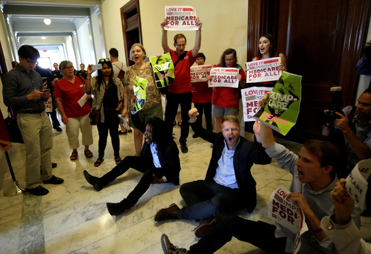 Image: Healthcare activists protest to stop the Republican health care bill at Russell Senate Office Building in Washington