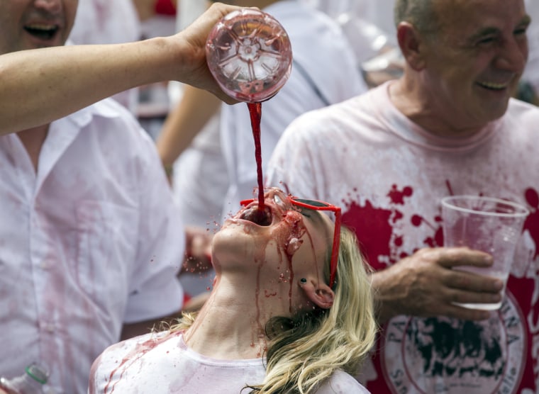 Image: A woman has sangria poured on her