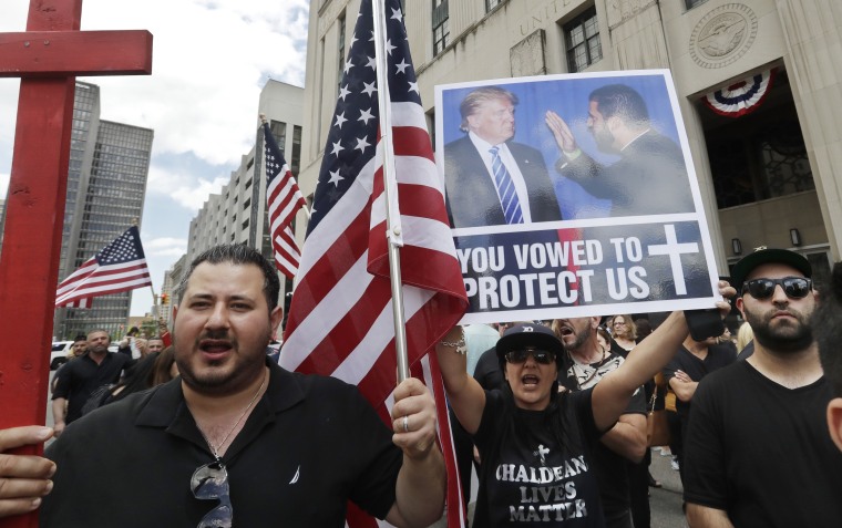 Iraqis and supporters rally outside the Theodore Levin United States Courthouse June 21, 2017 in Detroit, ahead of a hearing on a lawsuit that seeks to stop the government from deporting more than 100 Iraqi nationals.