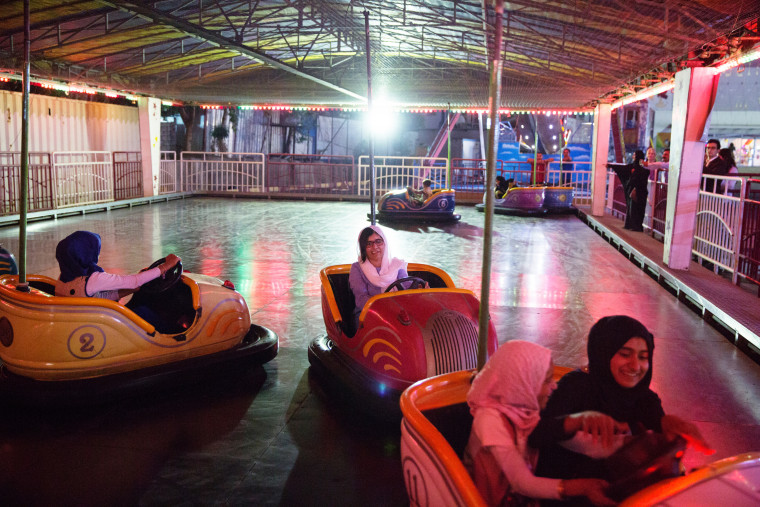 Image: Malala Yousafzai visits an amusement park with children displaced by ISIS conflict