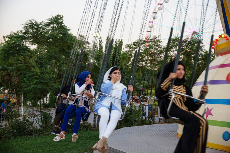 Image: Malala Yousafzai visits an amusement park and rides the swings