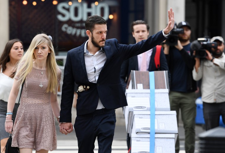 Image: The parents of Charlie Gard, Connie Yates and Chris Gard, arrive at the High Court with a spokesperson in London