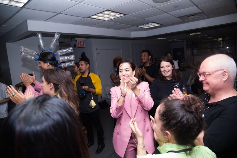 Mexican clothing designer Barbara Sanchez-Kane applauds her models, makeup team and stylists after her New York Fashion Week Men's show on July 12, 2017.