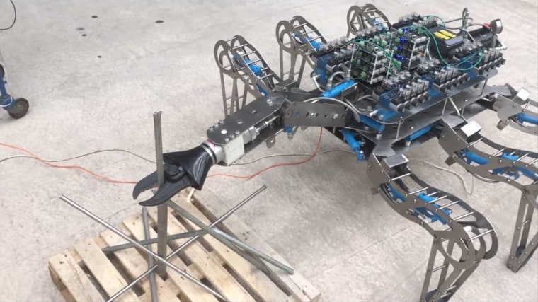 A screenshot of a video of Latro equipped with an arm carrying a hydraulic cutter