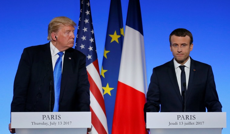 Image:  French President Emmanuel Macron and US President Donald Trump attend a joint news conference at the Elysee Palace in Paris