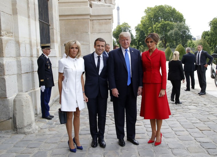 Image: French President Emmanuel Macron and his wife Brigitte  pose with President Donald Trump and First Lady Melania Trump