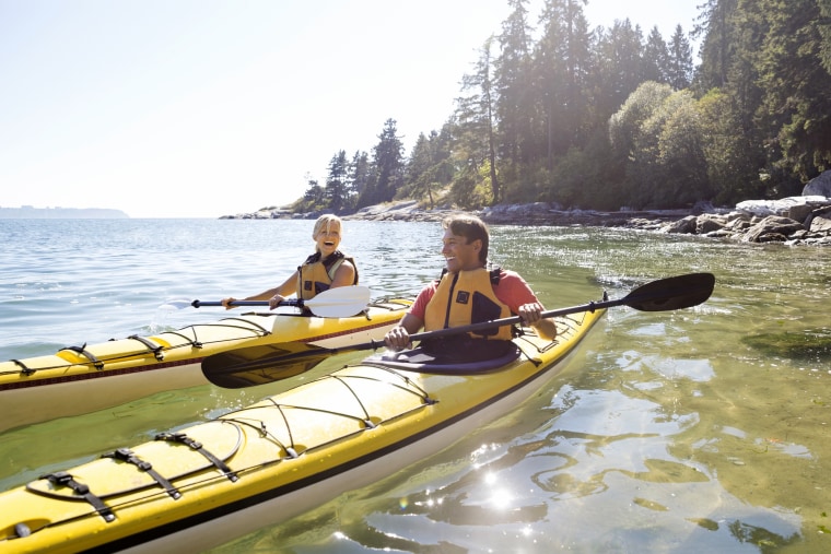 Image: Couple Kayaking on Sunny Ocean