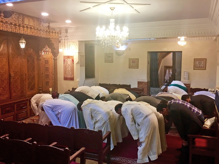 Image: Muslim men pray before the Iftar