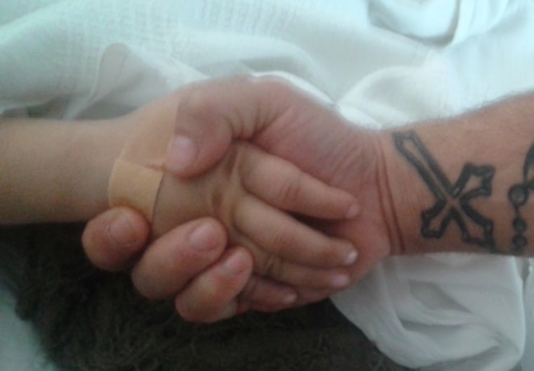 This photo of DeNicola holding hands with his son was later turned into the design for his tribute tattoo.