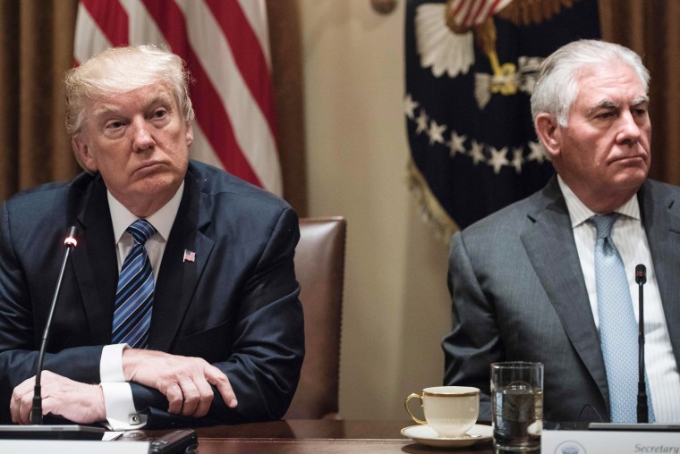 Image: US President Donald Trump (L) and US Secretary of State Rex Tillerson wait for a meeting
