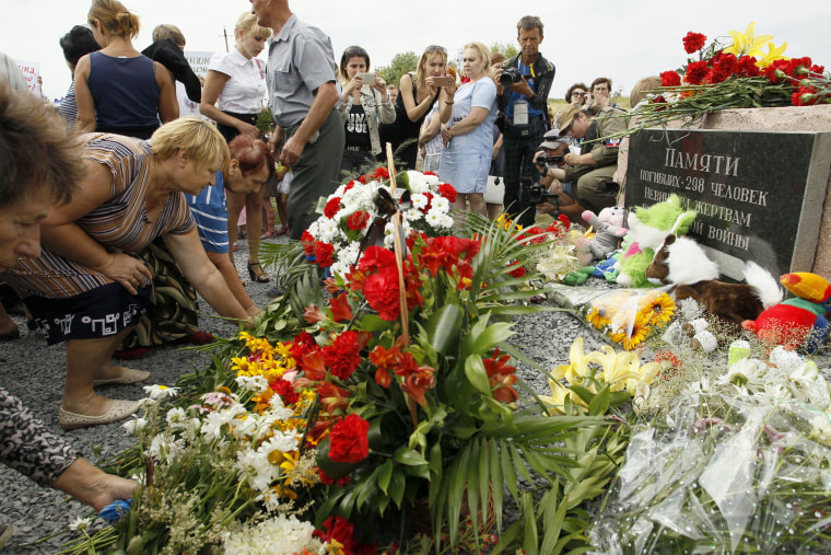 Image: Local residents lay flowers to commemorate victims of the Malaysian Airlines plane, near the village of Hrabove, Donetsk region, eastern Ukraine, July 17, 2017.