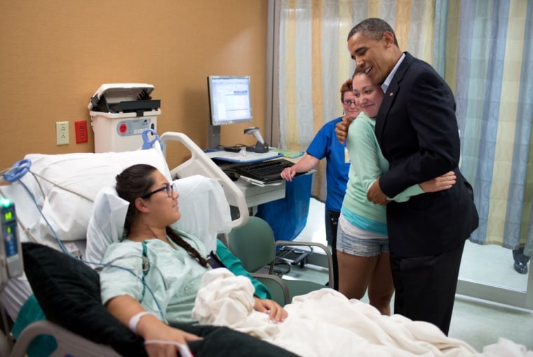 Image: President Barack Obama hugs Stephanie Davies