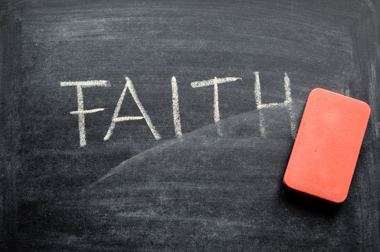 erasing faith, hand written word on blackboard being erased concept