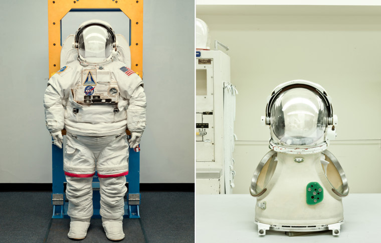 An Extravehicular Activity (EVA) space suit, left and space suit torso and helmet assembly at Johnson Space Center in Houston.