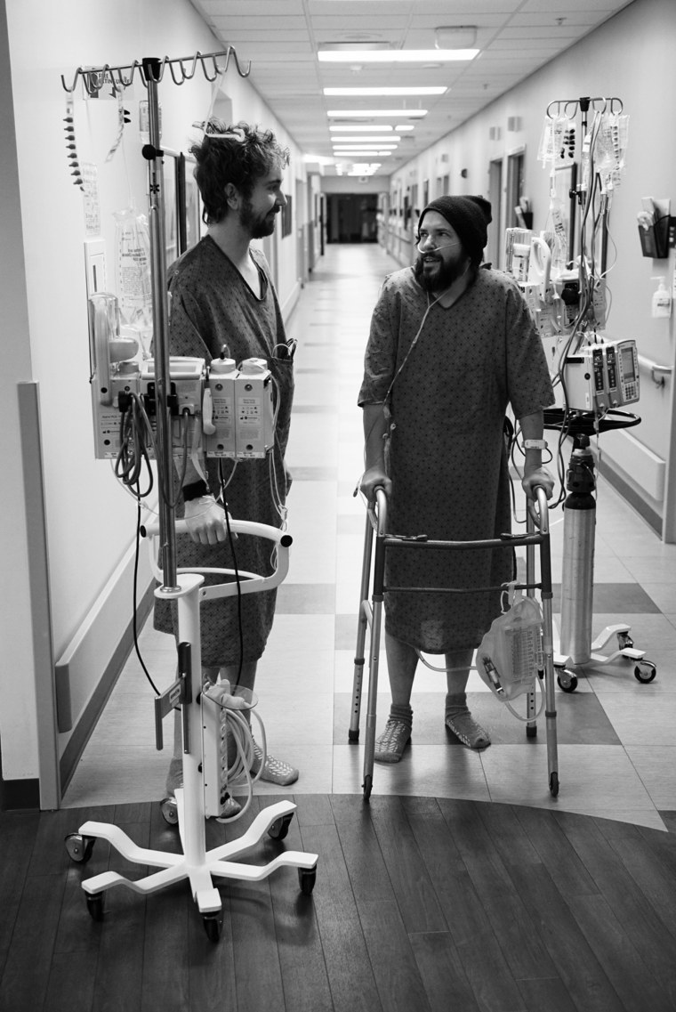 Robbins and Fox at the hospital after surgery. Doctors placed their recovery rooms far apart to encourage them to be active. 