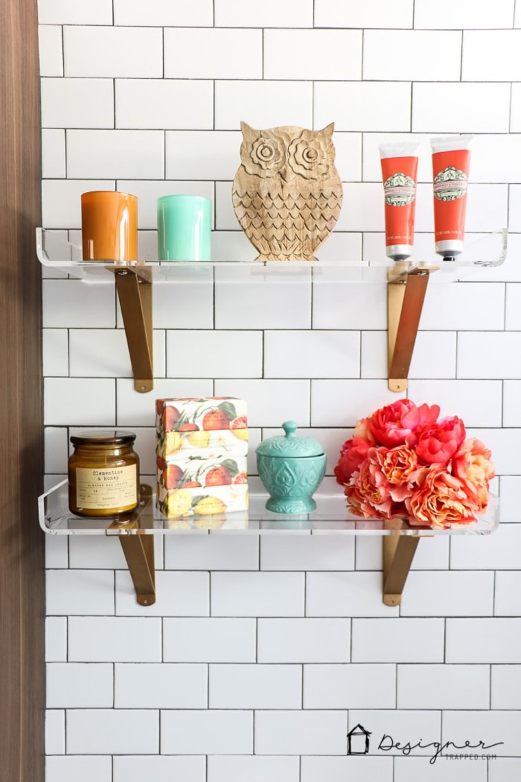 These lucite shelves really pop against the subway tile.
