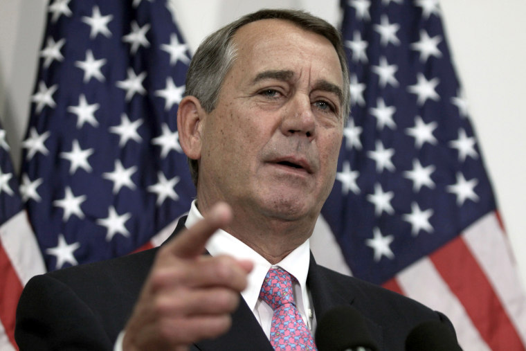 Image: Then-House Speaker John Boehner of Ohio talks with reporters on Capitol Hill in Washington