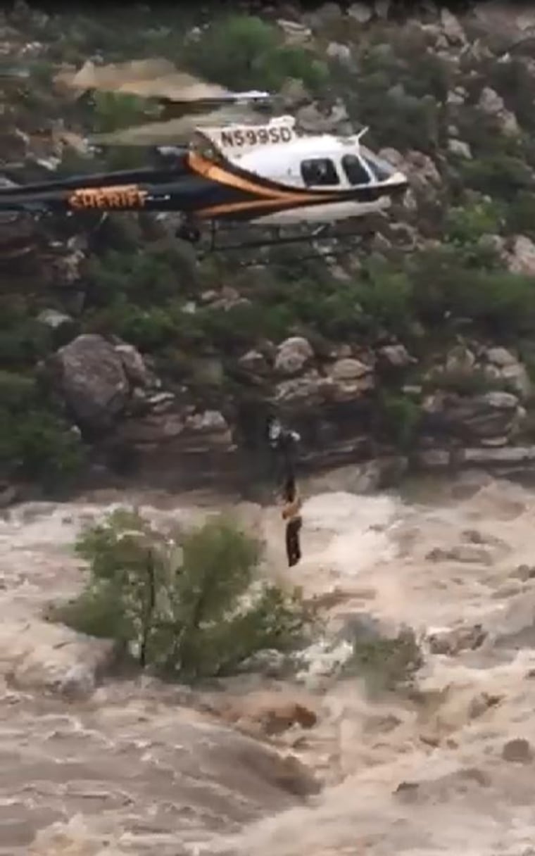 Image: A helicopter rescues a hiker in Tanque Verde Falls Trails near Redington Pass, near Tucson in southern Arizona