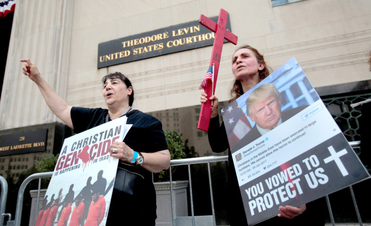 Image: FILE PHOTO: Protesters rally outside the federal court just before a hearing to consider a class-action lawsuit filed on behalf of Iraqi nationals facing deportation, in Detroit