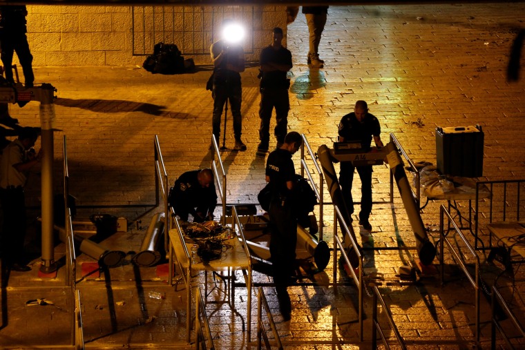 Image: Israeli security forces remove metal detectors which were recently installed at an entrance to the compound known to Muslims as Noble Sanctuary and to Jews as Temple Mount in Jerusalem's Old City