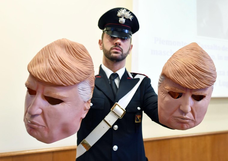 Image: Two brothers wearing Trump masks arrested in Turin