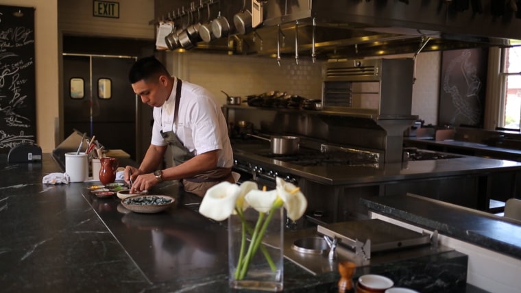 Garcia prepares a dish at The Commissary in San Francisco.