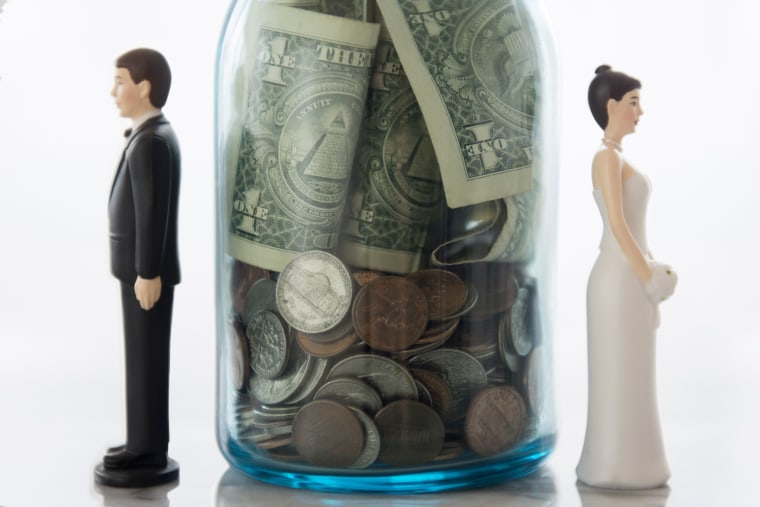 Image: Close Up of Bride and Groom Dolls Near Savings Jar