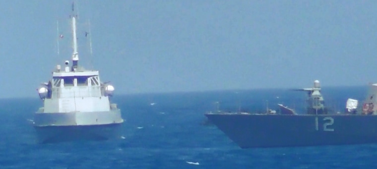 Image: Iranian vessel steers close to the U.S. Navy coastal patrol craft USS Thunderbolt in the Gulf i