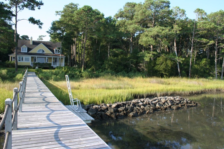 A living shoreline (granite rock sill with salt marsh, both natural and planted) in front of a house on Bogue Banks in NC