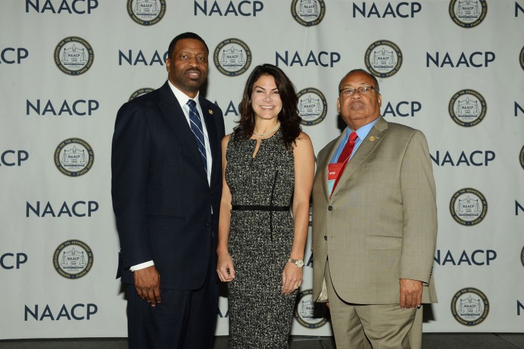 Image: Derrick Johnson, Interim President and CEO of the NAACP, from left, Belinda Johnson, Airbnb's Chief Business Affairs Officer and Leon Russell, Chair of the NAACP Board.