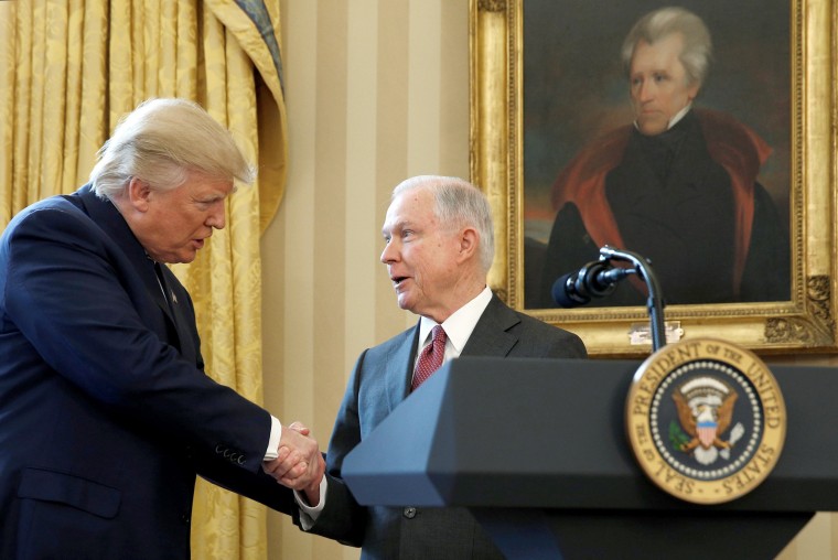 Image: President Trump congratulates new U.S.  Attorney General Sessions after being sworn in at the White House in Washington