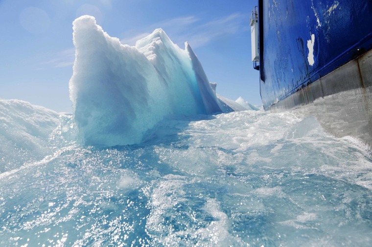 Image: Broken sea ice emerges from under the hull of the Finnish icebreaker MSV Nordica.