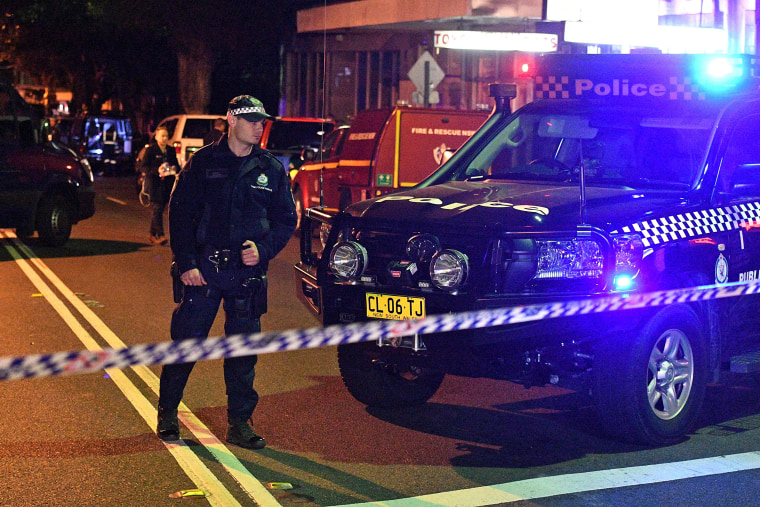 Image: Police man a check point in the Sydney inner suburb of Surry Hills