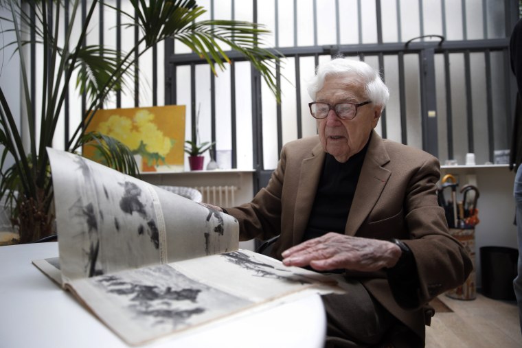 FILE- In this file photo dated Friday, May 2, 2014, John Morris, legendary Life Magazine and New York Times photo editor, speaks during an interview with the Associated Press in Paris, France.