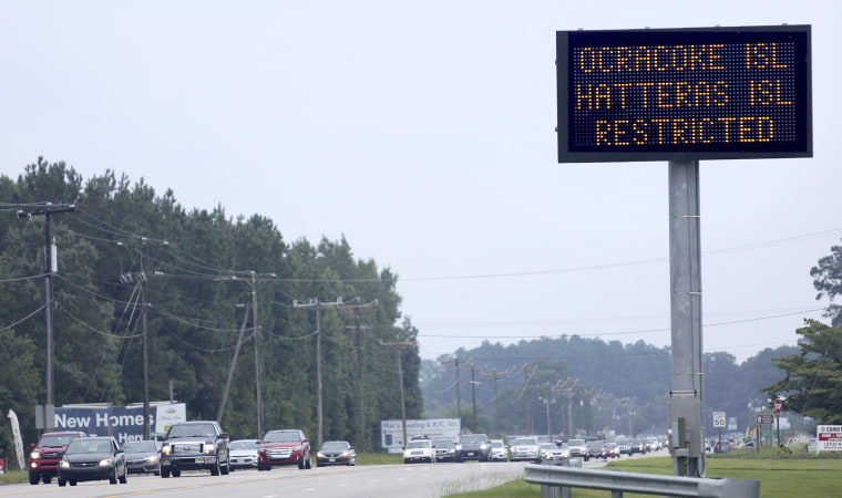 Image: A sign in Moyock, North Carolina, warns travelers that access to both Hatteras and Ocracoke Islands is restricted to residents only on July 29, 2017.