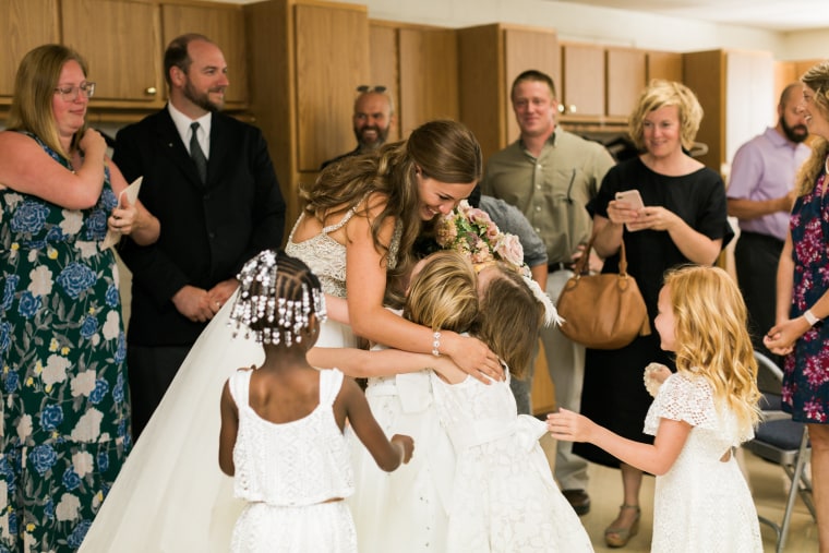 Marielle Slagel Keller greets her students after her wedding ceremony.