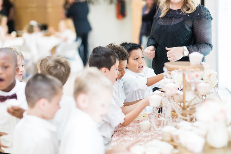 Students enjoy cupcakes at their own private reception following the ceremony.