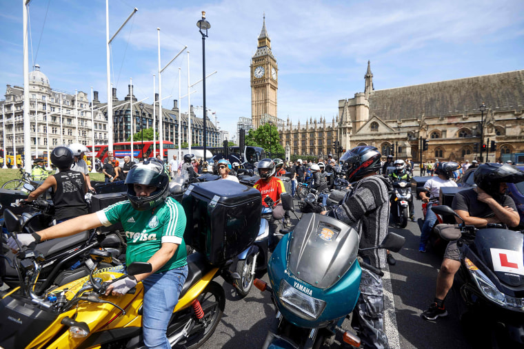 Image: Motorcycle delivery drivers and motorcyclists protest 