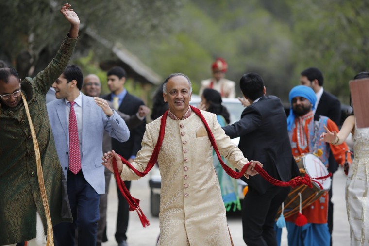 Before he started running, Mohan Iyer weighed up to 250 pounds, he said. Here, he dances at his son's wedding.