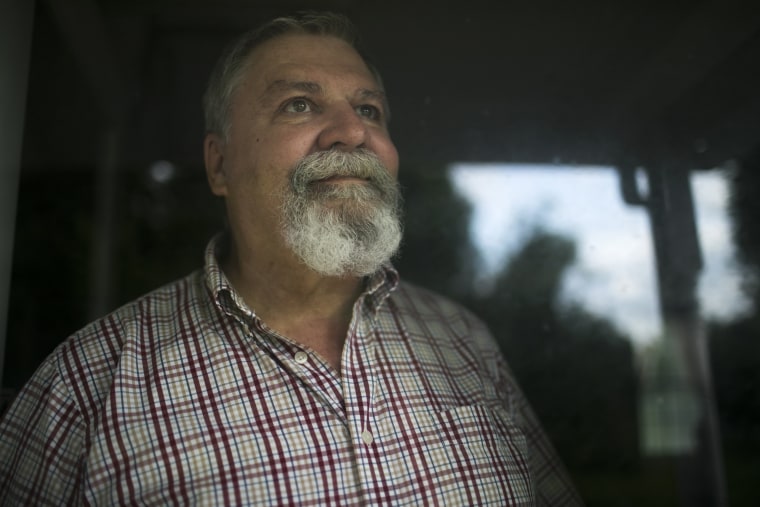 Image: Larry Harmon stands in his home in Kent, Ohio, on Aug. 4, 2017. Harmon was removed from the voting rolls after not voting in the last election.