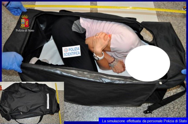 Image: A person taking part in a reenactment by Italian police on how a kidnapped British model was kept in a bag