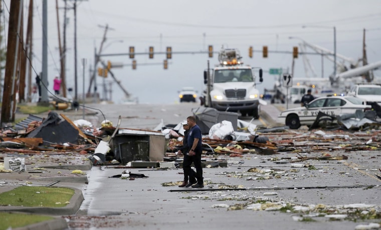 Image: Debris from a storm covers a street in Tulsa, Oklahoma, Aug. 6, 2017. A possible tornado struck near midtown Tulsa and causing power outages and roof damage to businesses.