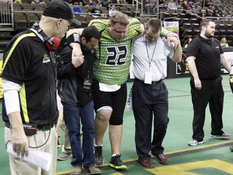 Lorenzen helped off the field after breaking his ankle in his last professional game in the Continental Indoor Football League.