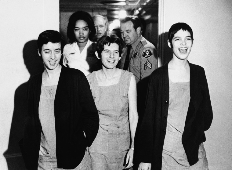 Three co-defendants in the Sharon Tate murder case, from left, Susan Atkins, Patricia Krenwinkel and Leslie Van Houten, laugh as they walk to court in Los Angeles for sentencing, March 29, 1971.