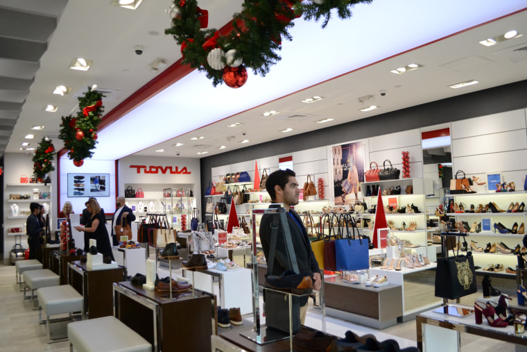 Employee working in the Puerto Rican shoe store Novus during the Holiday season in Pembroke Lakes Mall in Pembroke Pines, Florida.