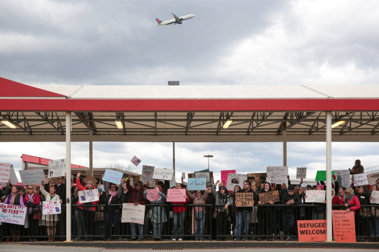 Image: Demonstrators yell slogans during anti-Donald Trump travel ban protests outside Hartsfield-Jackson Atlanta International Airport in Atlanta