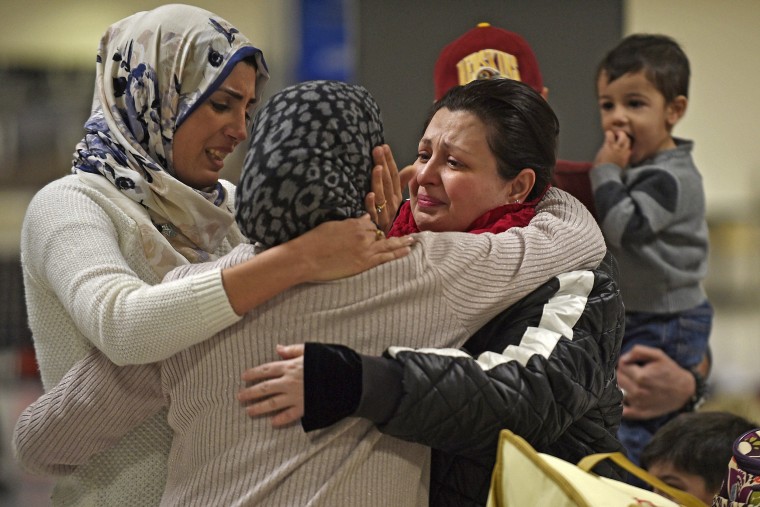 Image: An Iraqi family welcomes their grandmother at Dulles International Airport